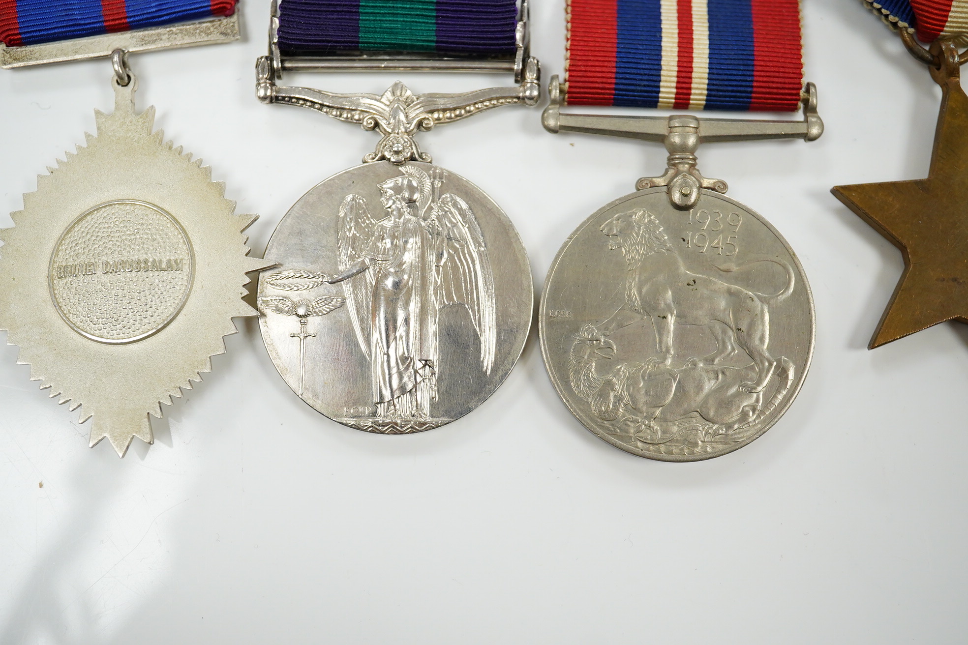 Seven military medals, including; a WWII medal group including the 1939-1945 Star, the France and Germany Star and the 1939-1945 Medal, a George V General Service Medal with a bar for Iraq awarded to GNR. G. Fuller R.A.